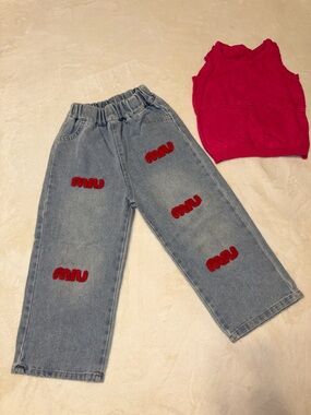 Miu Miu Light Blue Denim Jeans with Red Logo Patches & Pink Knit Tank